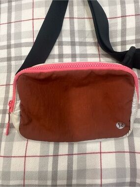 lululemon athletica Crossbody Bag in Rust with Pink Trim and Black Strap